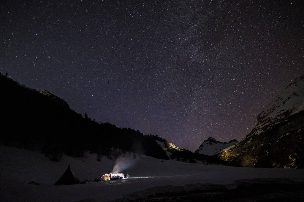 Unforgettable winter night in Pyrénées watching stars and shooting stars around the campfire